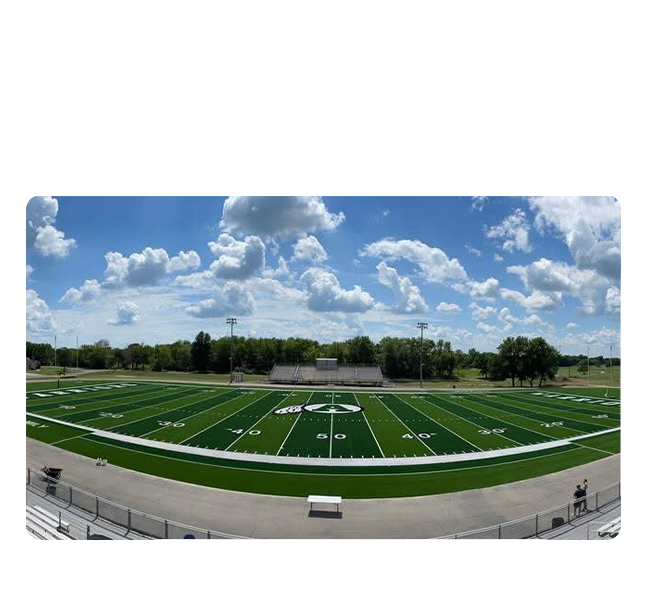Adiar Outdoor football field under a bright blue sky