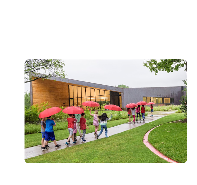 Students Walking Campus Pathway Students walking outside a school building